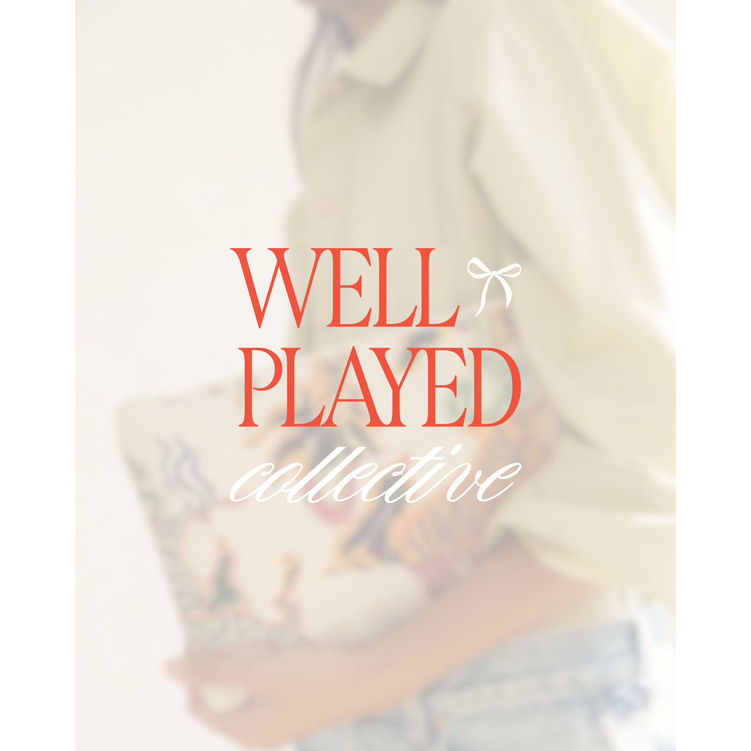 Blurred image with 'Well Played Collective' text overlay