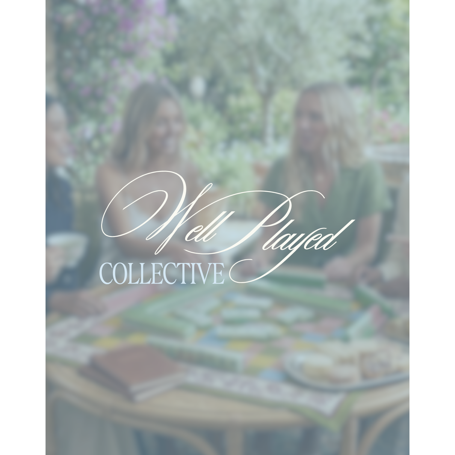 People sitting around a table outdoors with 'Well Played Collective' logo overlayed.